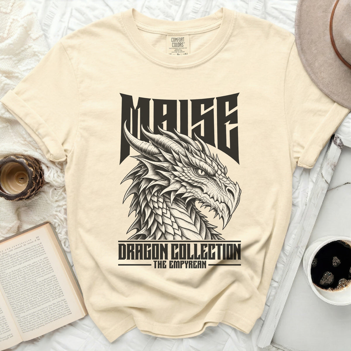 Cream t-shirt with "MAISE DRAGON COLLECTION THE EMPYREAN" text and dragon graphic.