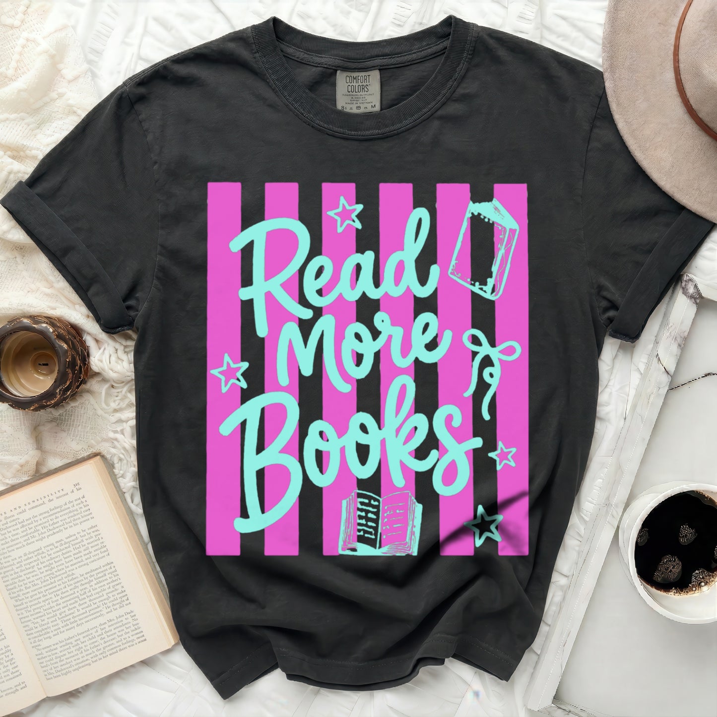 Black t-shirt with pink stripes and "Read More Books" graphic.