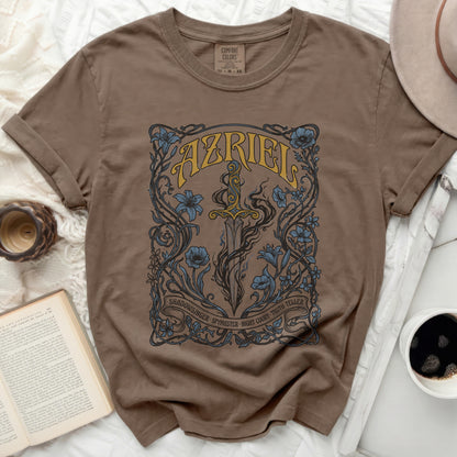 Brown t-shirt with intricate sword and floral design, text "AZRIEL" and "SHADOWSINGER SPYMASTER NIGHT COURT-TRUTH-TELLER".