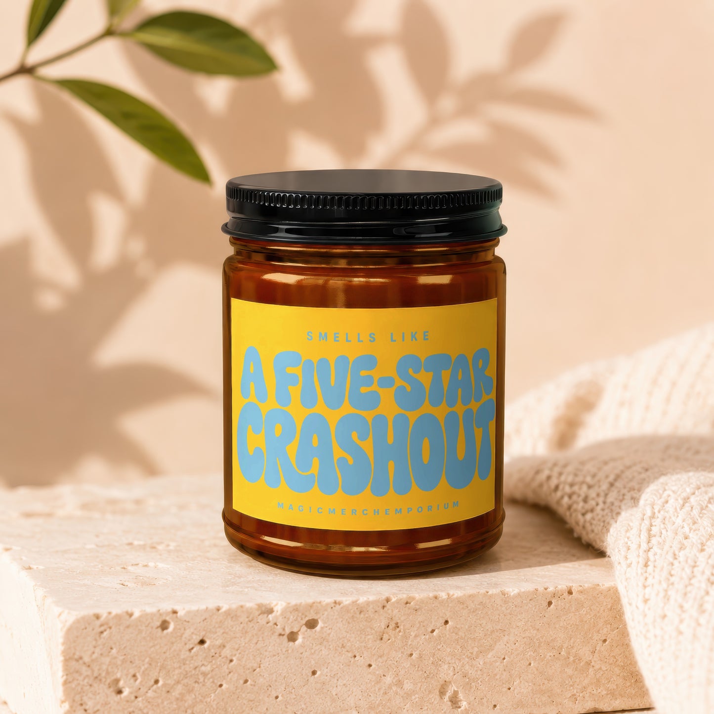 Brown candle in jar with yellow label reading "Smells like A FIVE-STAR CRASHOUT".