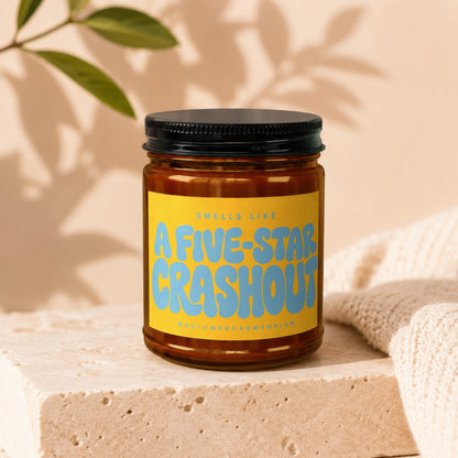 Brown candle in jar with yellow label reading "Smells like A FIVE-STAR CRASHOUT".