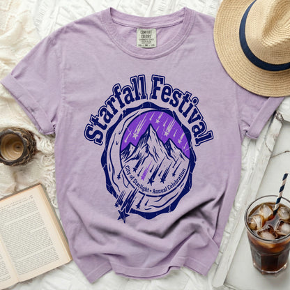 Purple t-shirt with "Starfall Festival City of Starlight Annual Celebration" graphic.