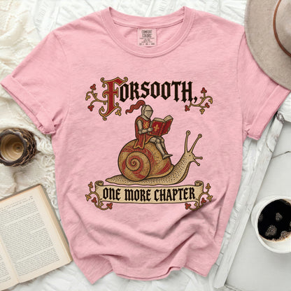 Pink shirt with knight on snail graphic and text "FORSOOTH, ONE MORE CHAPTER."