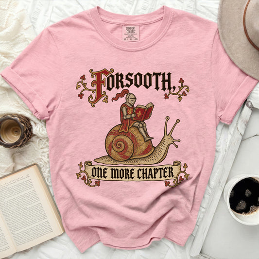 Pink shirt with knight on snail graphic and text "FORSOOTH, ONE MORE CHAPTER."