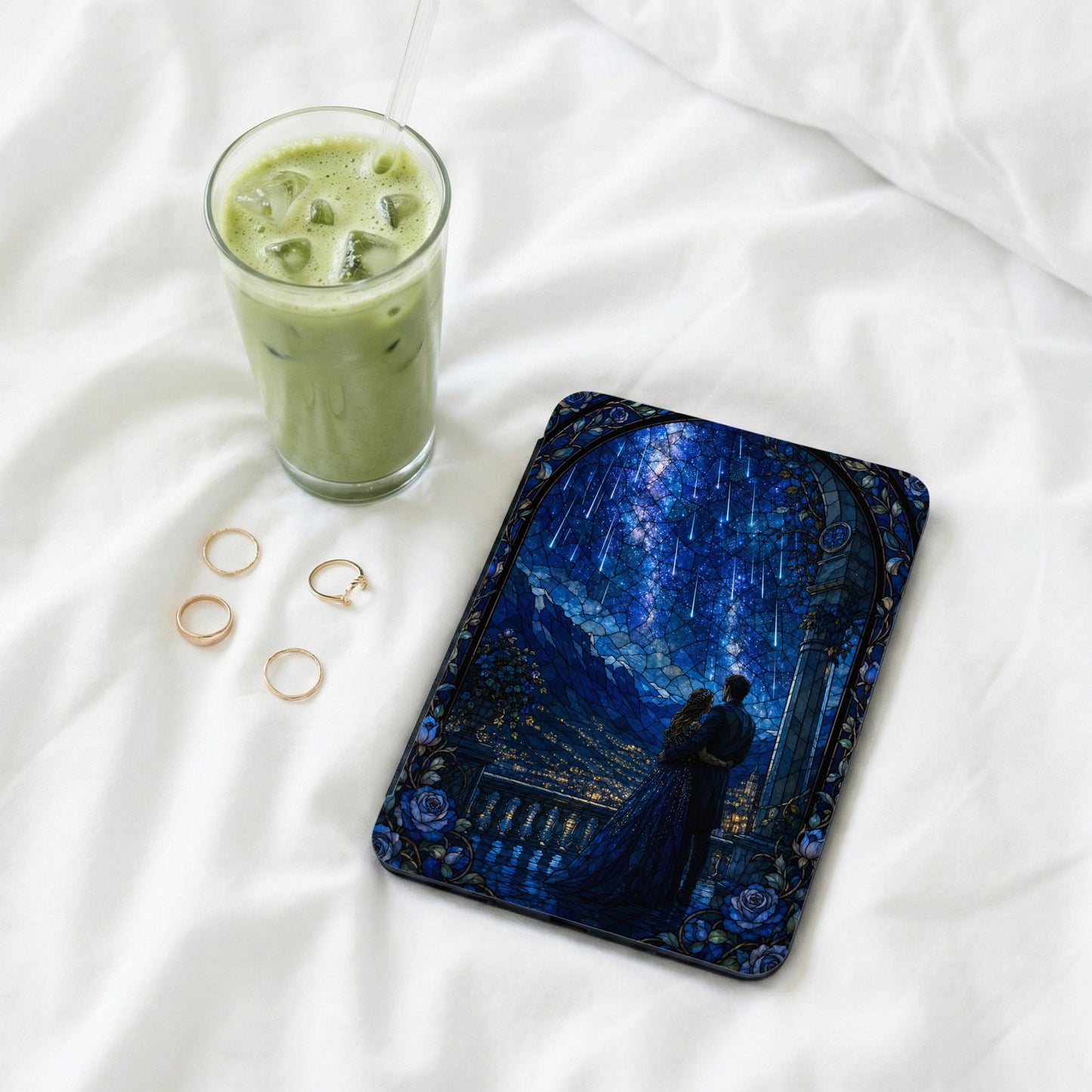 Phone case with stained glass design of couple under starry night sky.