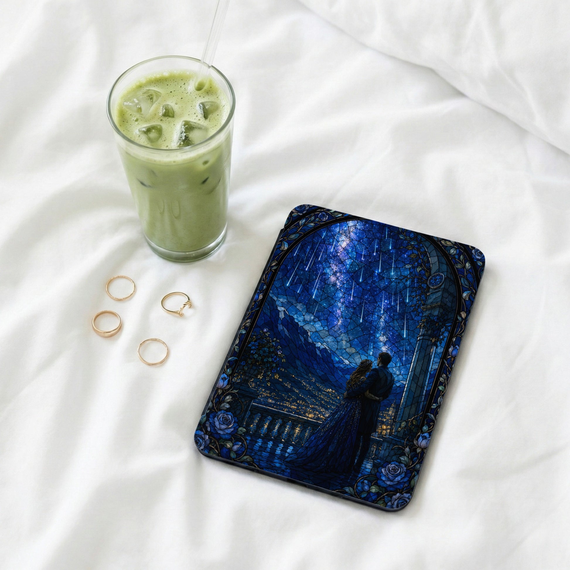 Phone case with stained glass design of couple under starry night sky.