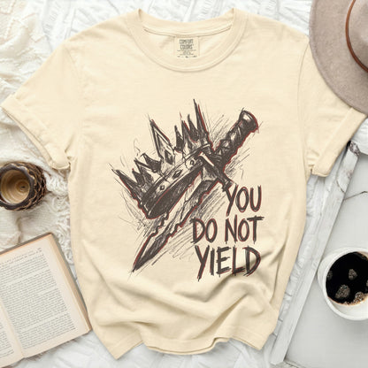 Cream Comfort Colors shirt with graphic of a crown and sword, and text "YOU DO NOT YIELD."