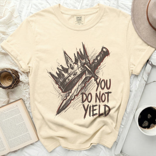 Cream Comfort Colors shirt with graphic of a crown and sword, and text "YOU DO NOT YIELD."