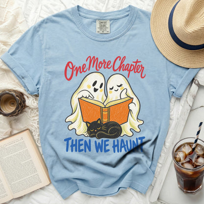 Light blue t-shirt with "One More Chapter Then We Haunt" and cartoon ghosts reading.