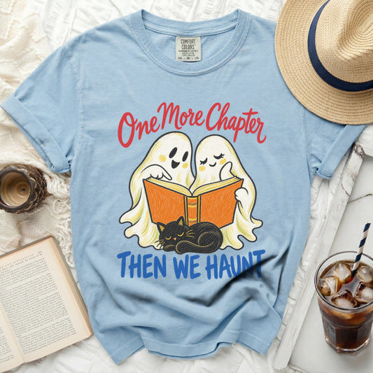 Light blue t-shirt with "One More Chapter Then We Haunt" and cartoon ghosts reading.