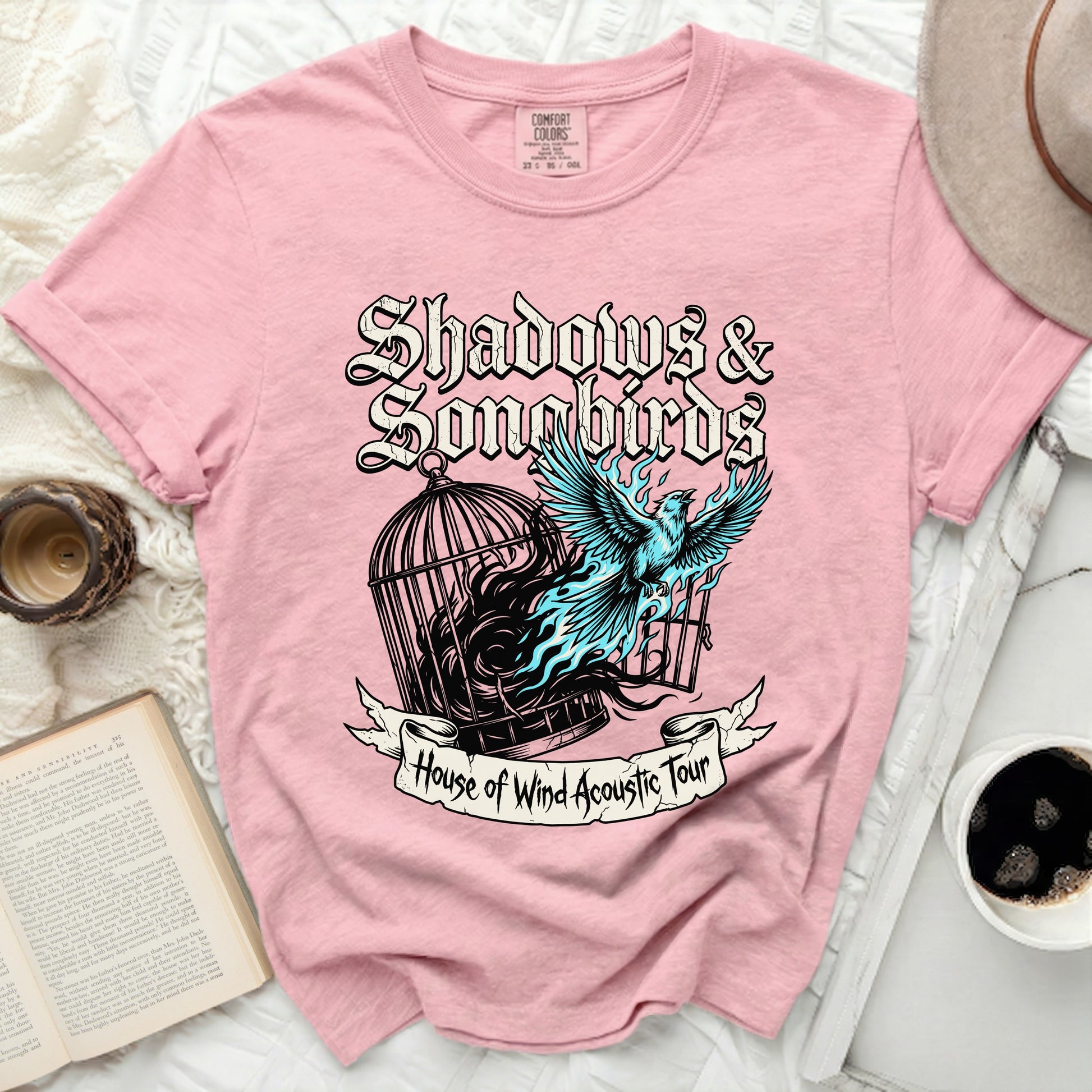 Pink t-shirt with "Shadows & Songbirds House of Wind Acoustic Tour" graphic.