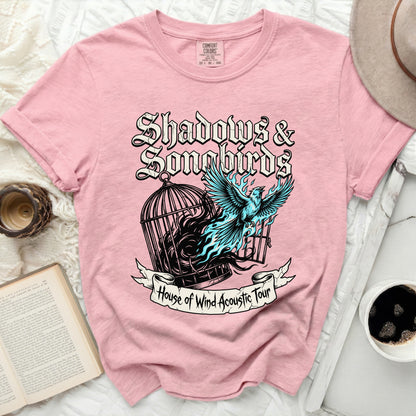 Pink t-shirt with "Shadows & Songbirds House of Wind Acoustic Tour" graphic.