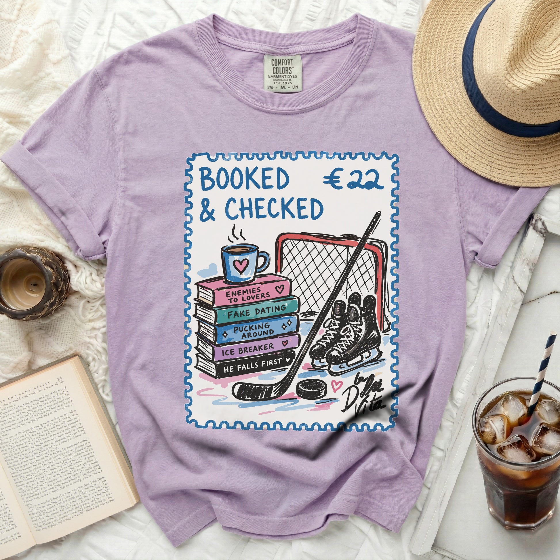 Purple t-shirt with "BOOKED €22 & CHECKED" stamp design.
