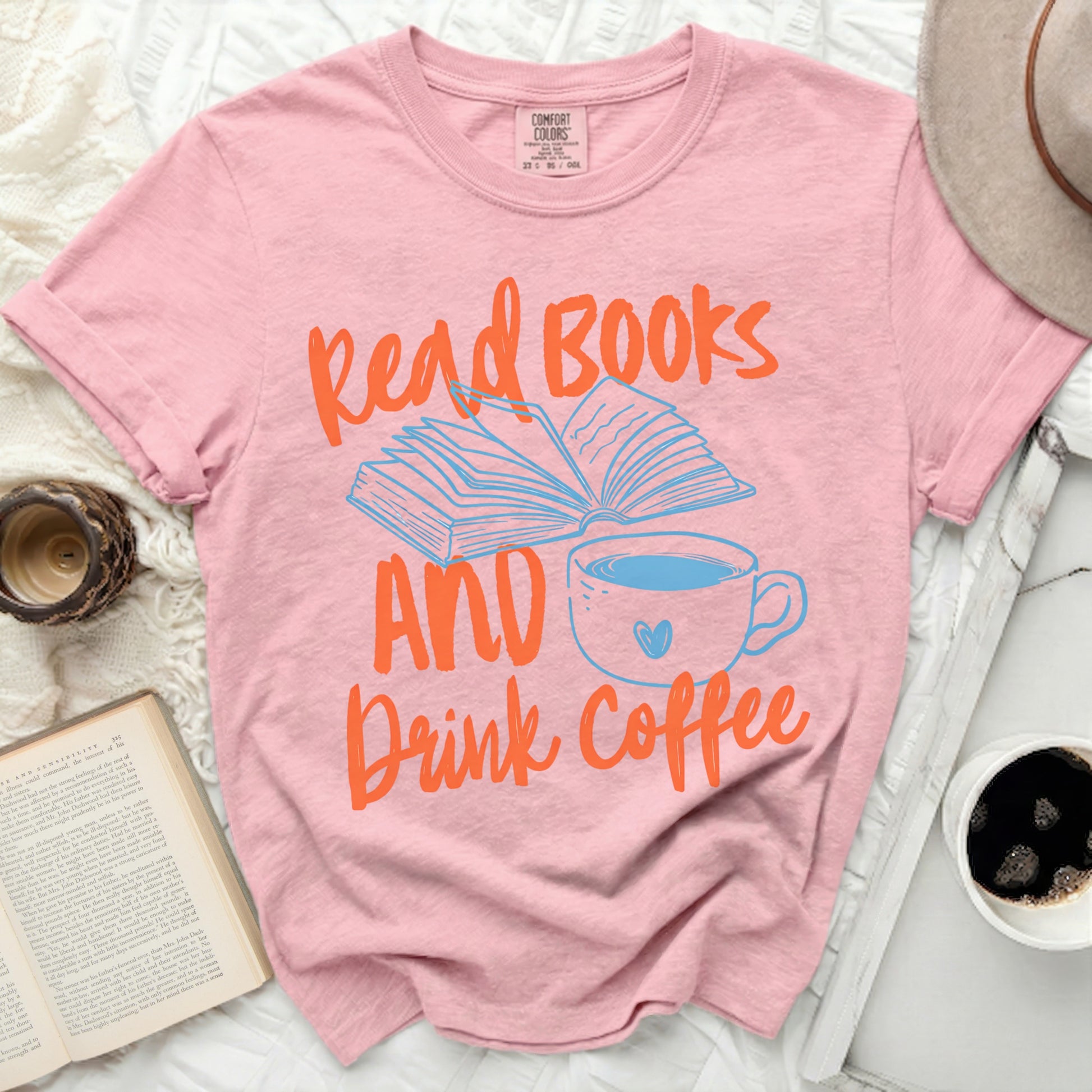 Pink t-shirt with "Read Books AND Drink Coffee" text and graphic.