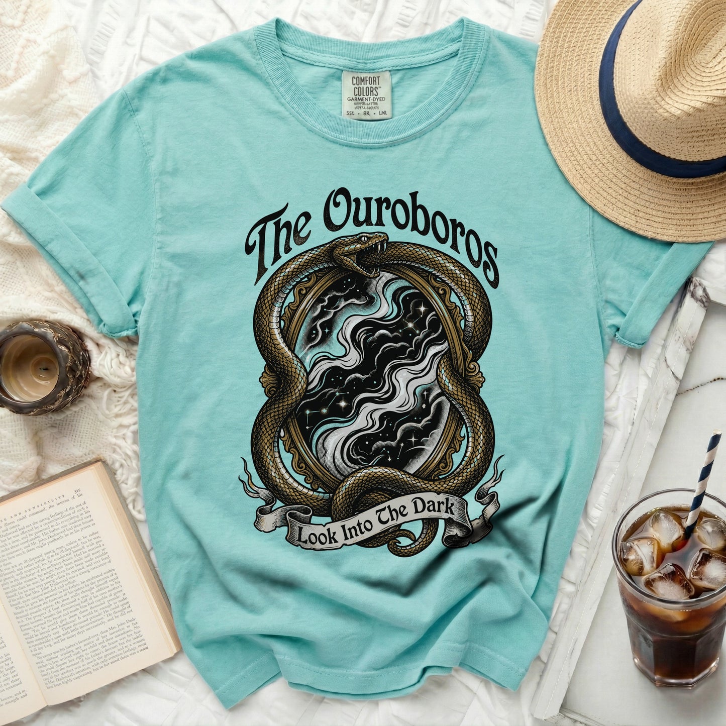 Aqua t-shirt with snake, mirror, and text "The Ouroboros Look Into The Dark".