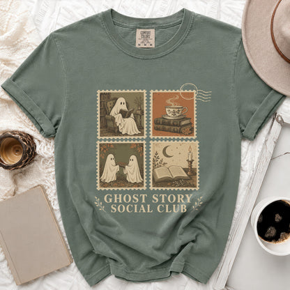 Green t-shirt with ghost illustrations in postage stamps and "Ghost Story Social Club" text.