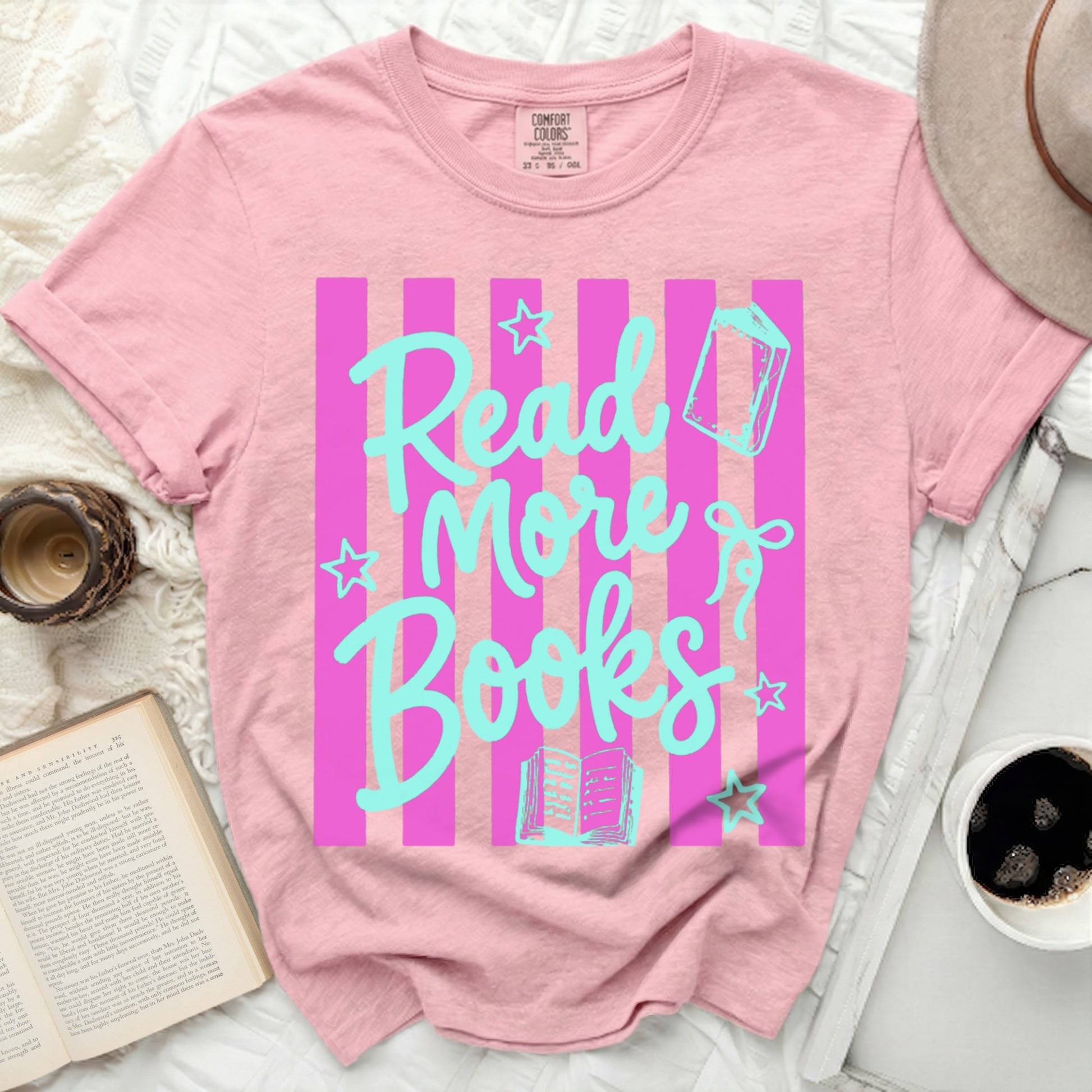Pink t-shirt with blue stripes and "Read More Books" text.