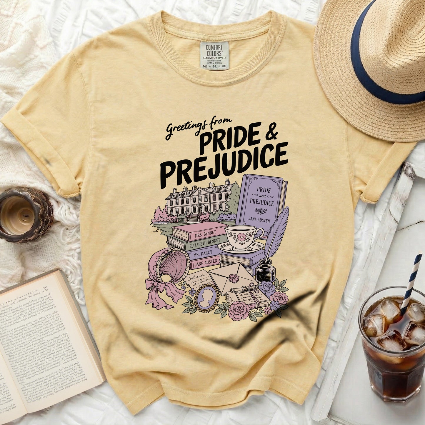 Yellow t-shirt with Pride and Prejudice book stack illustration.