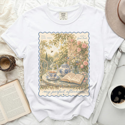 White t-shirt with "Tea, Earl Grey, and a Good Book" floral illustration.