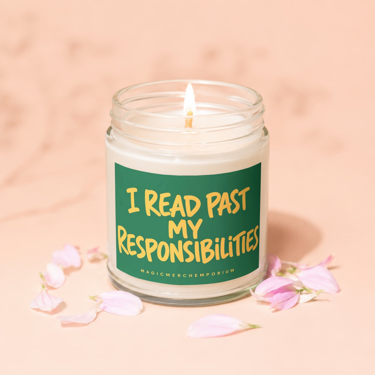 Lit candle in a jar with a green label that reads "I READ PAST MY RESPONSIBILITIES"