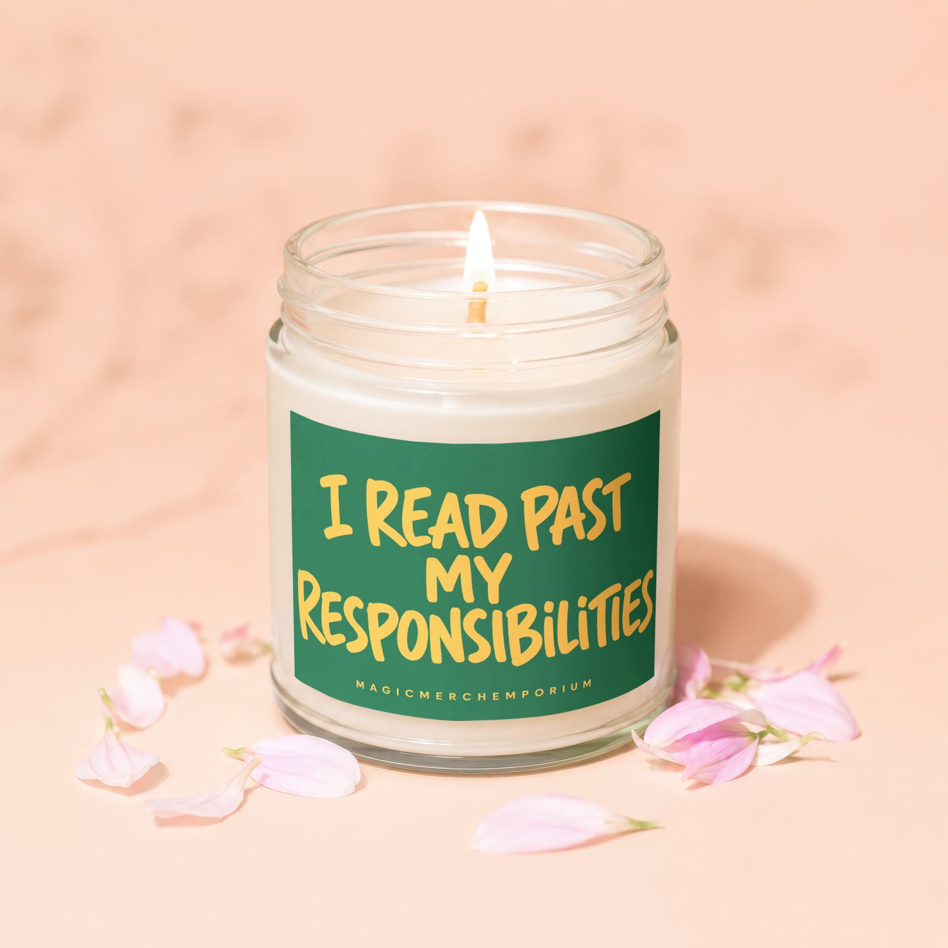 Lit candle in a jar with a green label that reads "I READ PAST MY RESPONSIBILITIES"