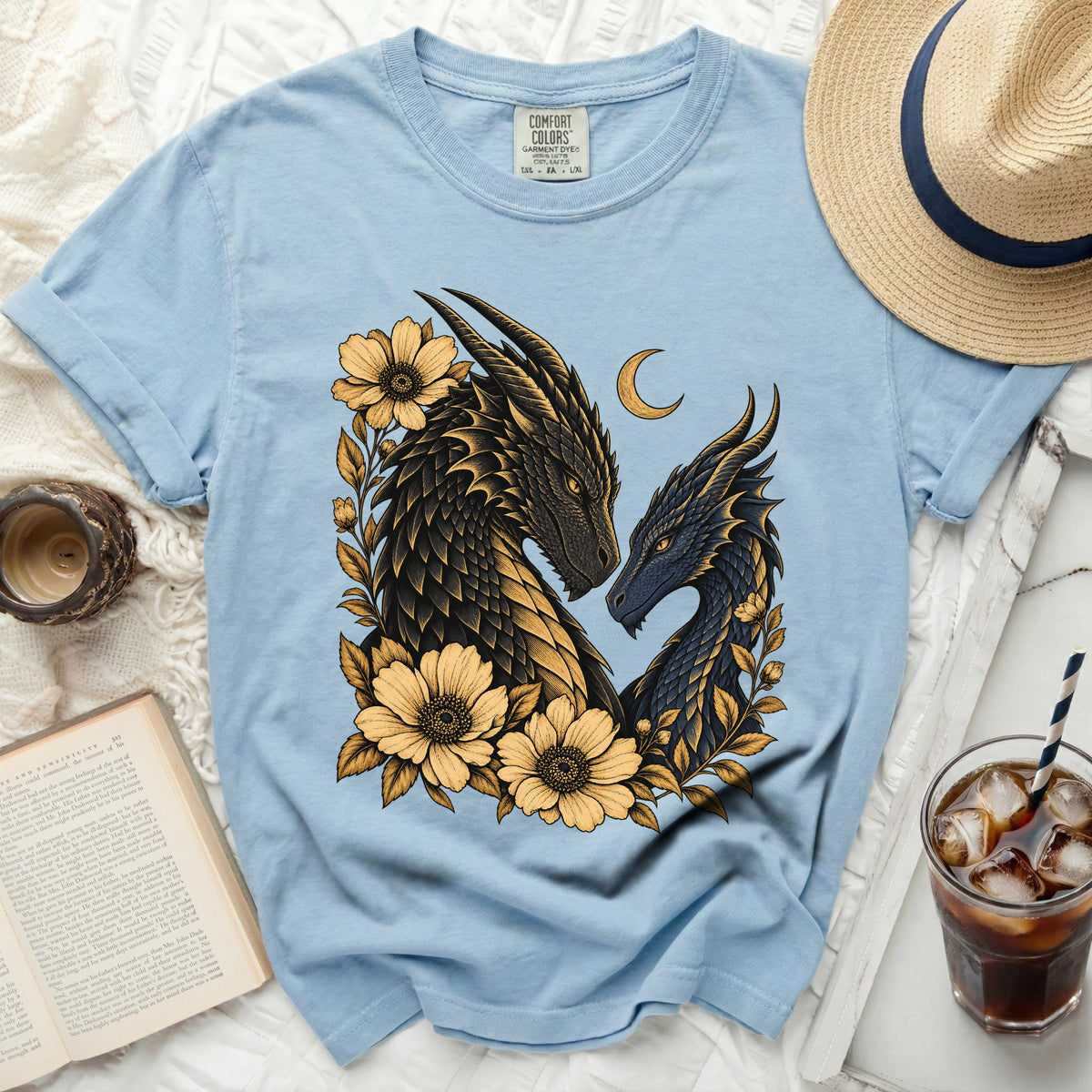 Blue t-shirt with a gold and black dragon design, yellow flowers, and a crescent moon.