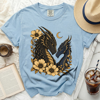 Blue t-shirt with a gold and black dragon design, yellow flowers, and a crescent moon.
