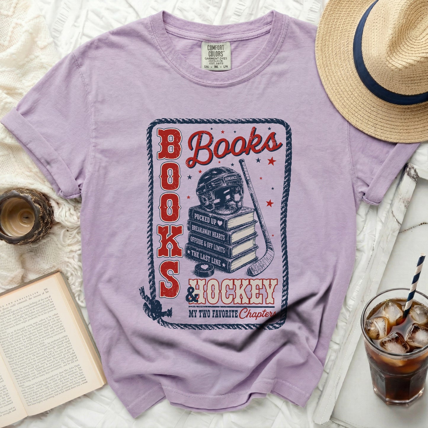 Purple t-shirt with "Books and Hockey My Two Favorite Chapters" graphic.