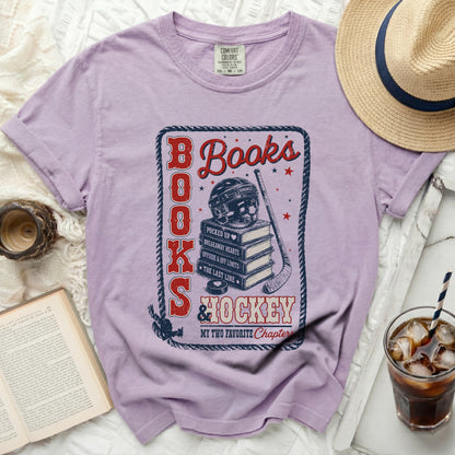 Purple t-shirt with "Books and Hockey My Two Favorite Chapters" graphic.