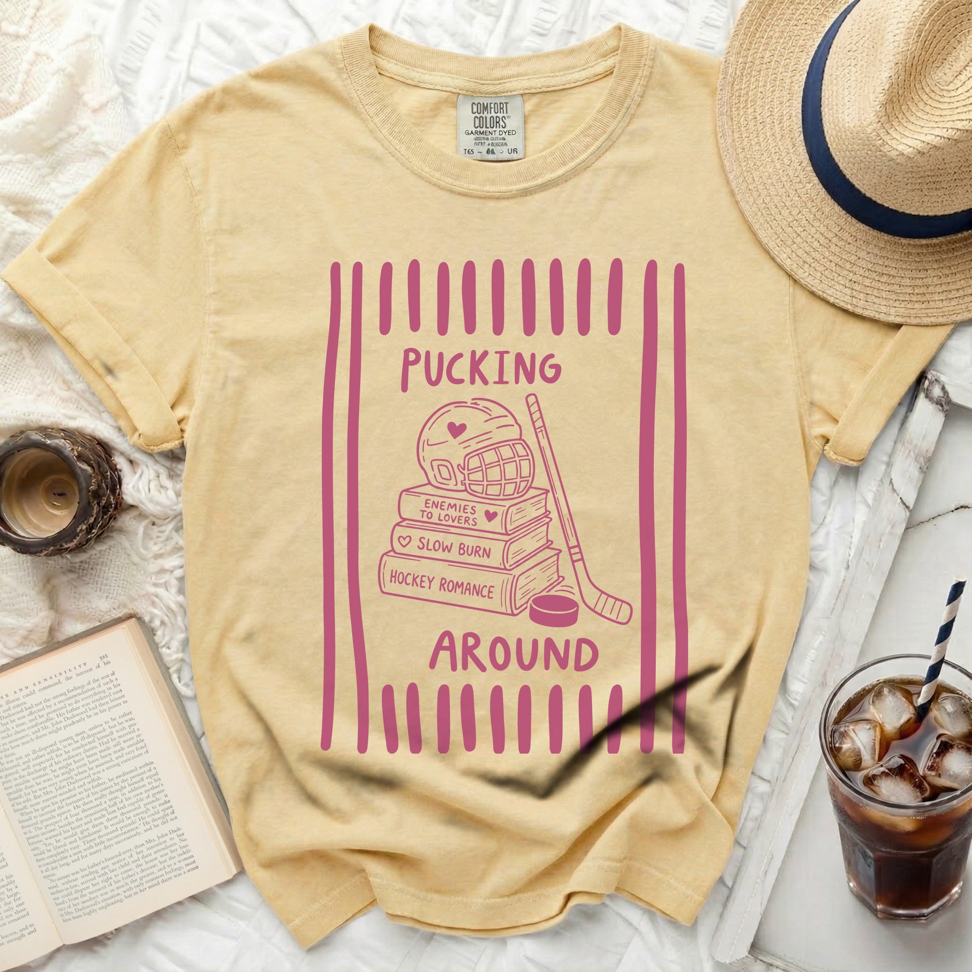 Yellow t-shirt with "Pucking Around" hockey romance text and graphics.