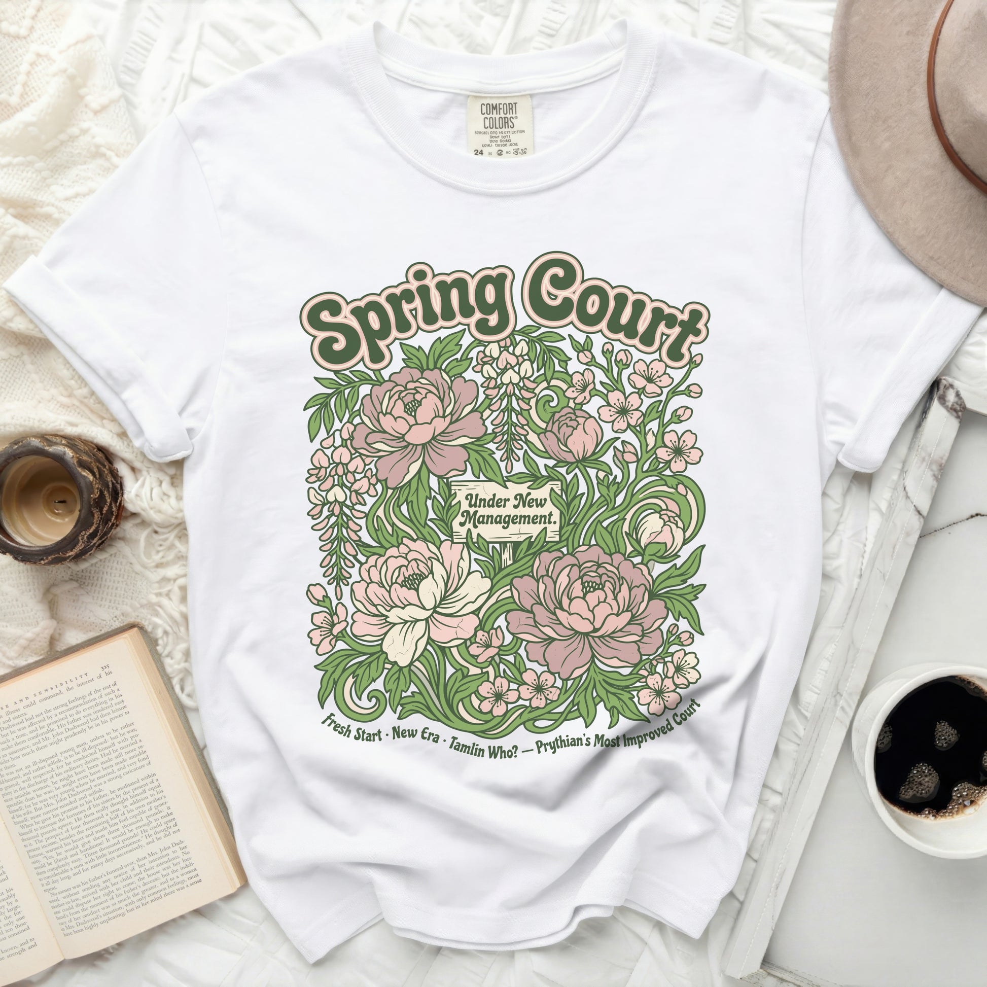 White t-shirt with floral graphic reading "Spring Court" and "Under New Management."