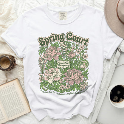 White t-shirt with floral graphic reading "Spring Court" and "Under New Management."