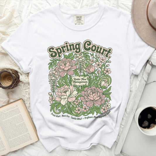White t-shirt with floral graphic reading "Spring Court" and "Under New Management."