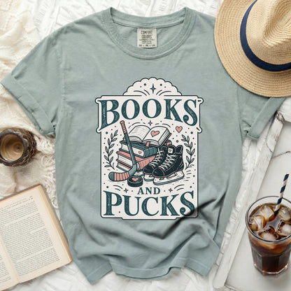 T-shirt with "Books and Pucks" text, hockey stick, skates, and book.