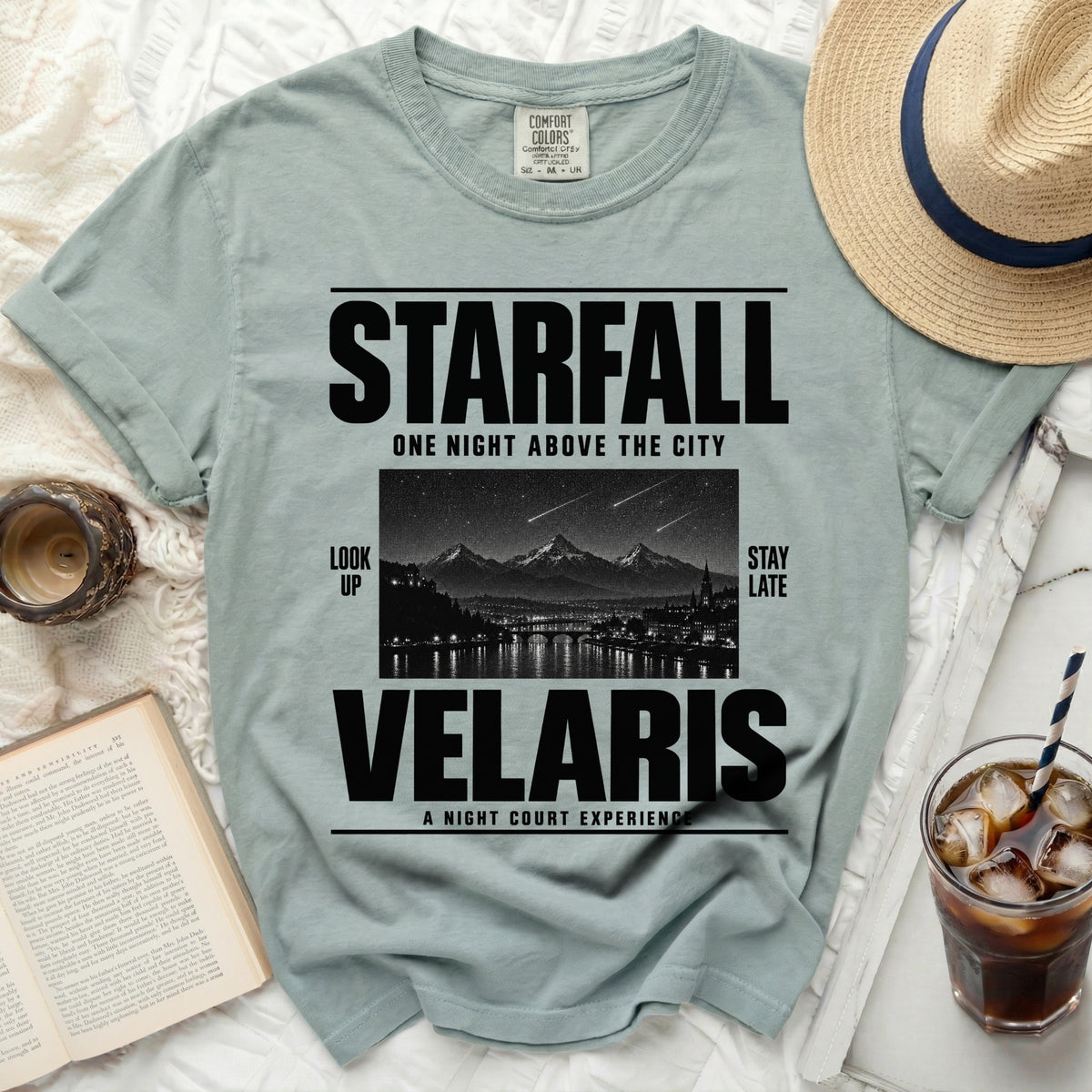 Light blue t-shirt with Starfall, Velaris text and city illustration.