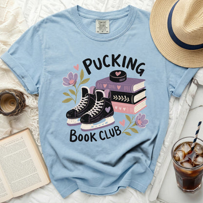 Light blue t-shirt with "Pucking Book Club" graphic and roller skates.