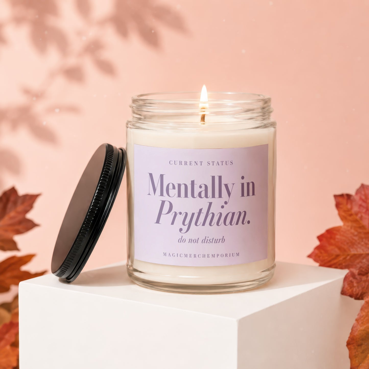 Lit candle with "Mentally in Prythian. do not disturb" text on lavender label.