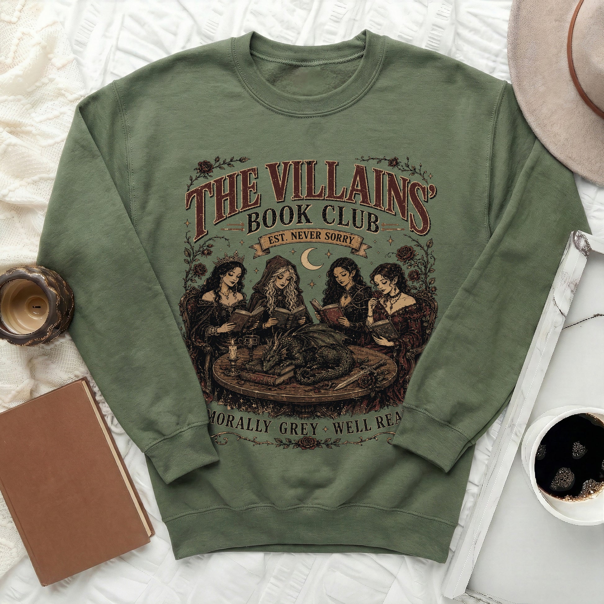 Green sweatshirt with "The Villains Book Club Est. Never Sorry" graphic and dragon.