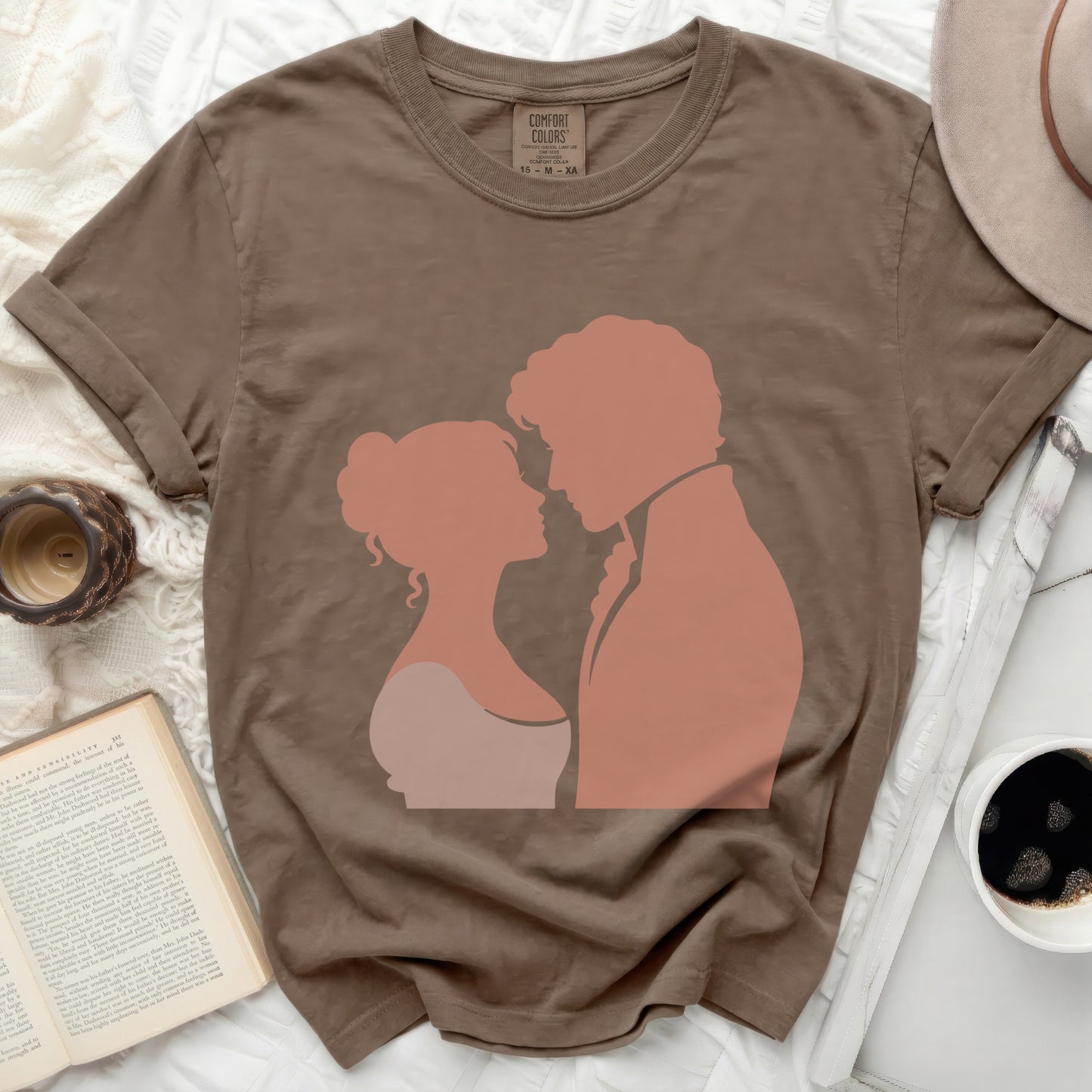 Brown t-shirt with silhouette of a couple looking at each other.