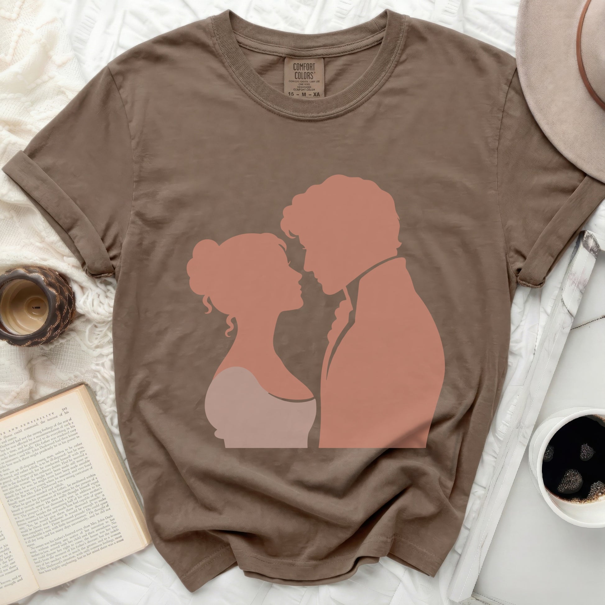 Brown t-shirt with silhouette of a couple looking at each other.