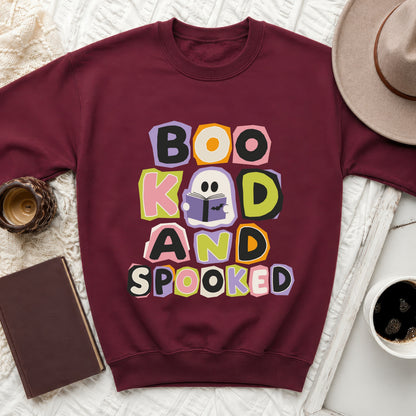Maroon sweatshirt with "Boo K ad and Spooked" text and a ghost design.