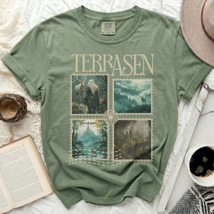Green t-shirt with four postage stamp images of fantasy landscapes and text.