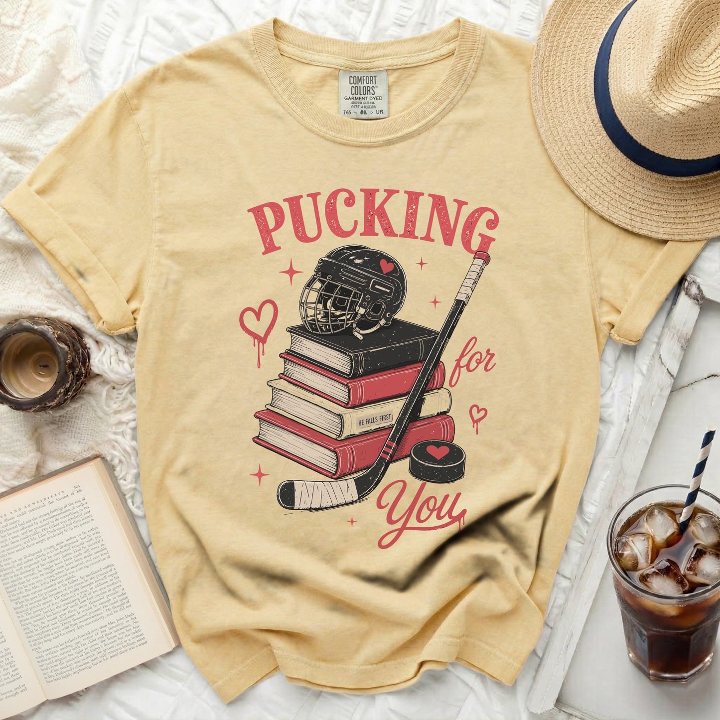 Yellow t-shirt with hockey gear and "Pucking for you" text.