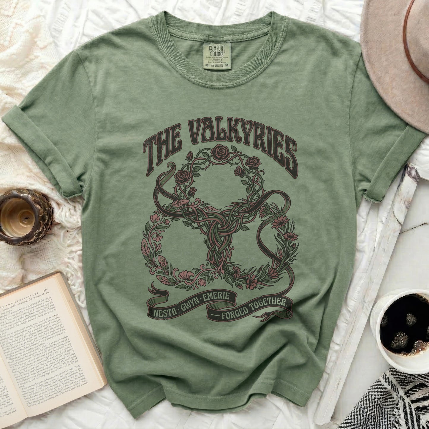 Green t-shirt with "The Valkyries" logo featuring interwoven roses and vines.