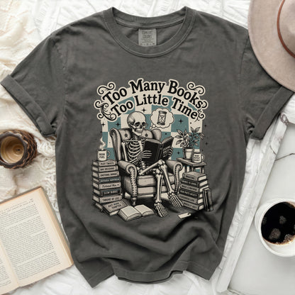 Skeleton reading a book with text "Too Many Books Too Little Time".