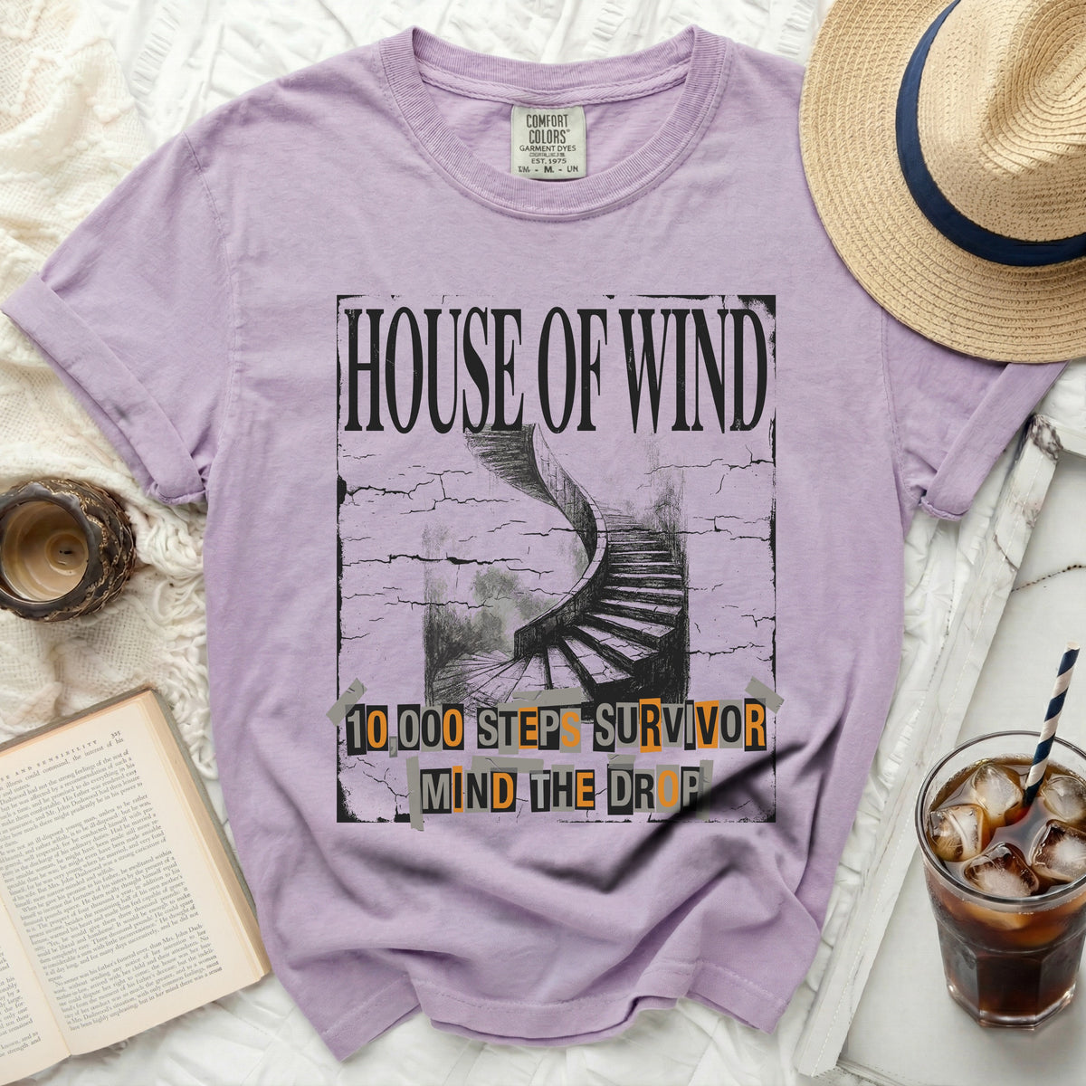 Purple t-shirt with "HOUSE OF WIND" and "10,000 STEPS SURVIVOR MIND THE DROP" graphic.