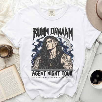 White t-shirt with "Ruhn Danaan Agent Night Tour" graphic featuring a man.