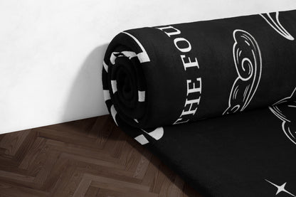 Black and White rolled blanket with text design