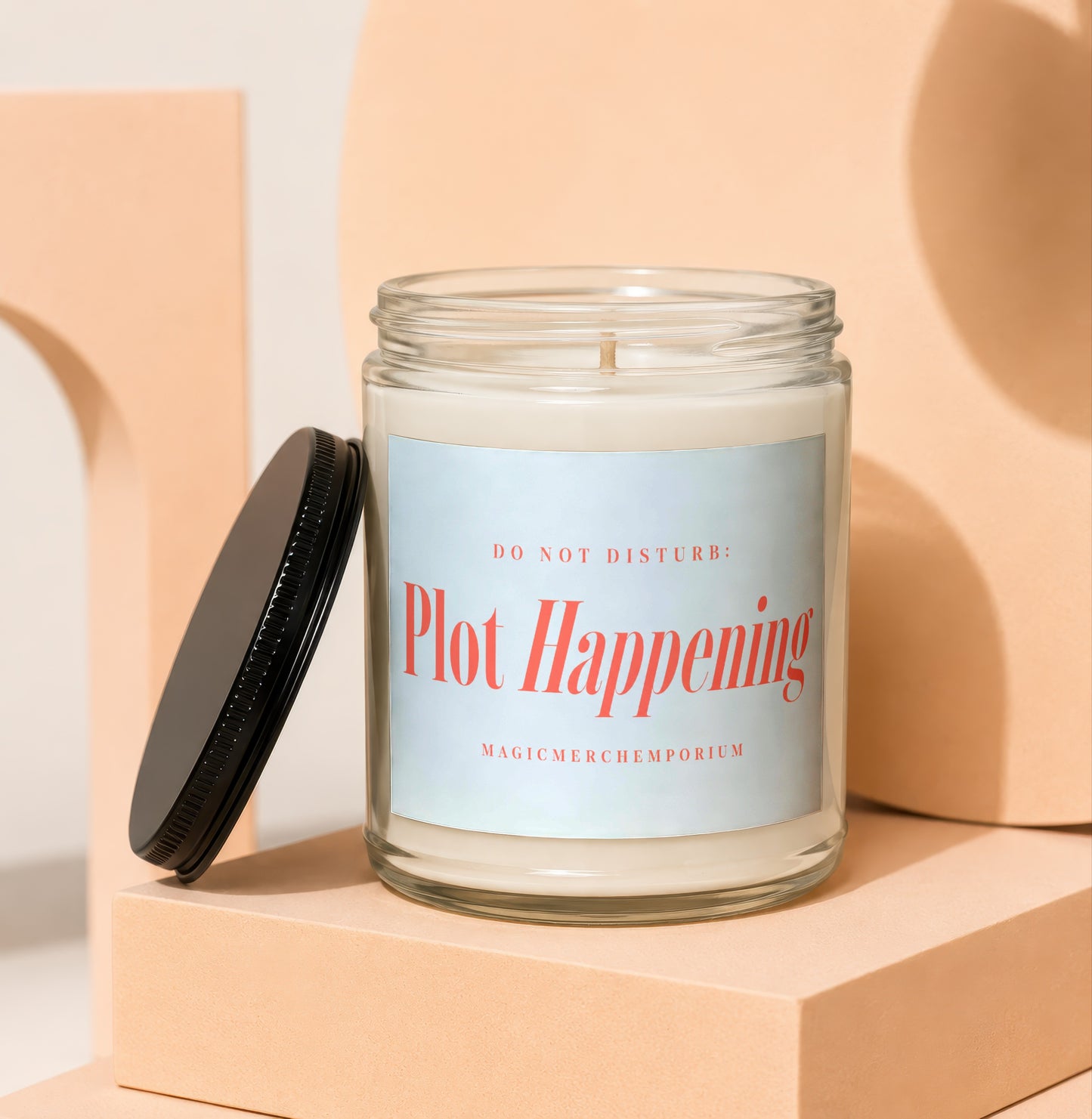 Jar candle with black lid titled "Plot Happening" and "Do Not Disturb" text.