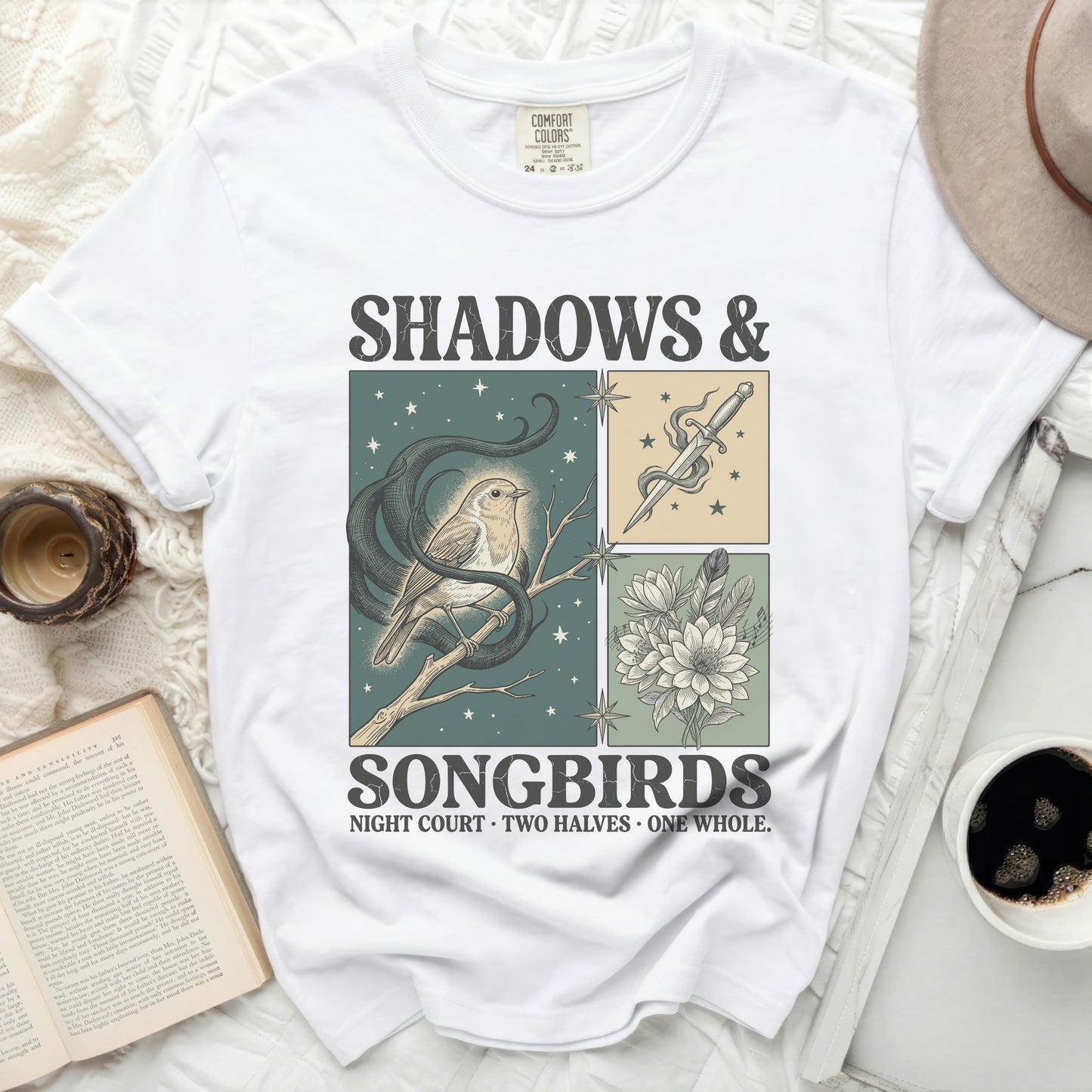 White Comfort Colors t-shirt with "Shadows & Songbirds" graphic and snake, bird, dagger, and flowers.